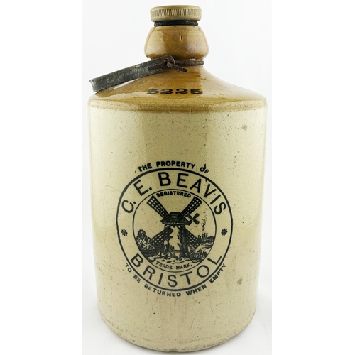 337 - BRISTOL FLAGON. 16ins tall. CE BEAVIS, with carry handle, rear spigot. Really heavy. Damages. 8/10 U... 