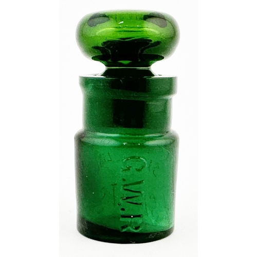 37 - G.W.R. SMELLING SALTS BOTTLE. 2.75ins tall. Embossing letters. Base embossed, rear minor base chip.