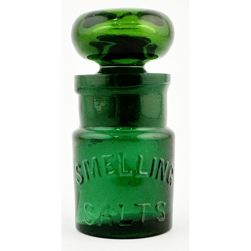 37 - G.W.R. SMELLING SALTS BOTTLE. 2.75ins tall. Embossing letters. Base embossed, rear minor base chip.