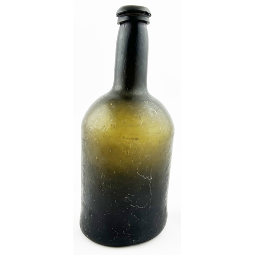 399 - FREEBLOWN CYLINDER WINE BOTTLE. 9.25ins tall. Olive green glass, base pontil. Minor lip flakes.