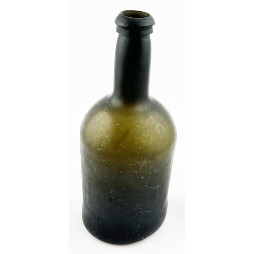 399 - FREEBLOWN CYLINDER WINE BOTTLE. 9.25ins tall. Olive green glass, base pontil. Minor lip flakes.