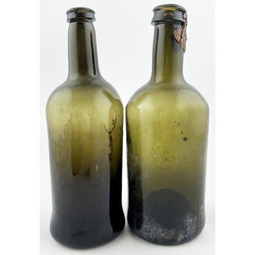 401 - FREEBLOWN CYLINDER WINE BOTTLES DUO. Tallest 8.5ins. Light olive green glass, base pontil. Minor lip... 