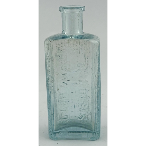 416 - HOLDENS TOMMY BOTTLE. 4ins tall. Embossing to both sides. Thin lip sliver.