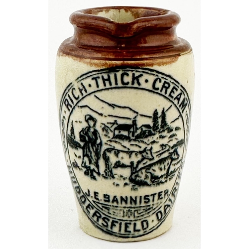 52 - HUDDERSFIELD CREAM POT. 3.5ins tall. Centre maid & cow pict, rear handle. Port Dundas base p.m.