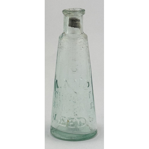 83 - LEEDS CHEMIST BOTTLE. 4ins tall. Heavily embossed LAND/ CHEMIST/ BRIGGATE/ LEEDS, on reverse ROSEBUD... 