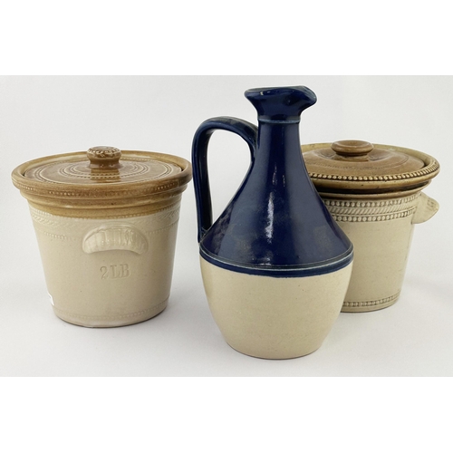 97 - BUTTER CROCK DUO plus decanter. Tallest 8.5ins. Plain lidded butter crocks & decanter. Buchan base p... 