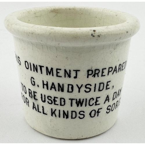 477 - G. HANDYSIDE OINTMENT POT. (OP p76) 1.5ins tall. Thick walled pot with chunky top rim. Four lines of... 