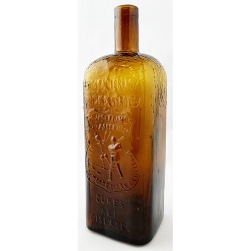 480 - WM RADAMS MICROBE KILLER BOTTLE. 10.5ins tall. Deep amber glass rectangular shape. Crude embossing (... 