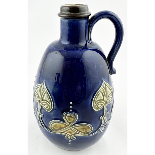 486 - ROYAL DOULTON ARTWARE WHISKY JUG. 7.5ins tall. Blue shiny glaze with green leaf type sprigs, rear ha... 