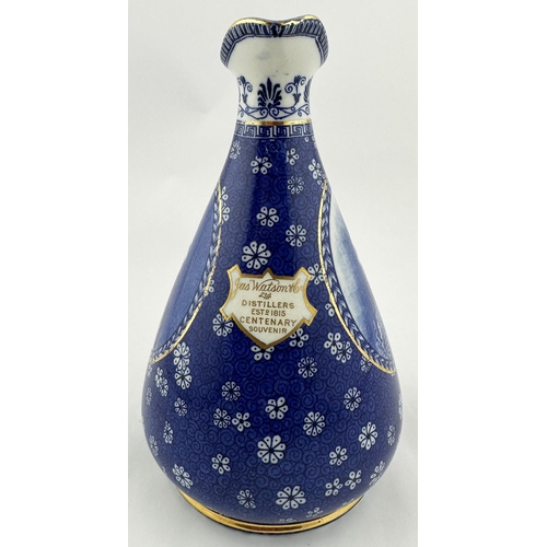 488 - JAS WATSON CENTENARY WHISKY DECANTER. 8.5ins. Attractive blue & white ornately decorated pear shape ... 