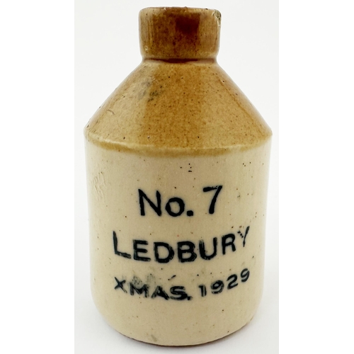 512 - LEDBURY 1929 MINIATURE FLAGON. 2.75ins tall. Tan top, black transfer, rear handle been reglued, repa... 