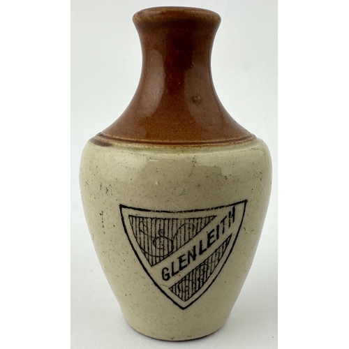 516 - GLENLEITH MINIATURE JUG. 3.25ins tall. Dark brown top, black transfer of shield type shape to front,... 