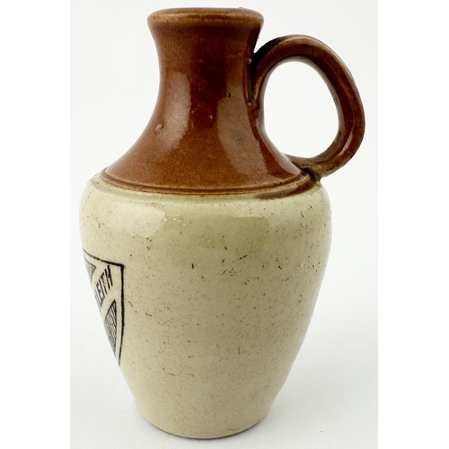 516 - GLENLEITH MINIATURE JUG. 3.25ins tall. Dark brown top, black transfer of shield type shape to front,... 