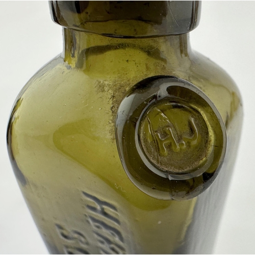 518 - MINIATURE SEALED GIN BOTTLE. 4.5ins tall. Olive green glass, embossed to one side HERMAN JANSEN/ SCH... 