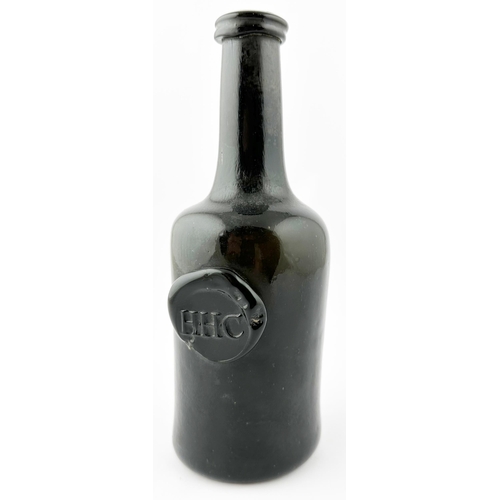 520 - . SPLIT SIZE HHC SEALED CYLINDER WINE BOTTLE. Unrecorded in Burton. 8.5ins tall. Black glass, c. 186... 