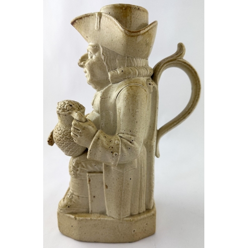 527 - BRAMPTON SALT GLAZE TOBY JUG. 9.5ins tall. Portly gent holding a jug of ale, with removable hat. Rea... 