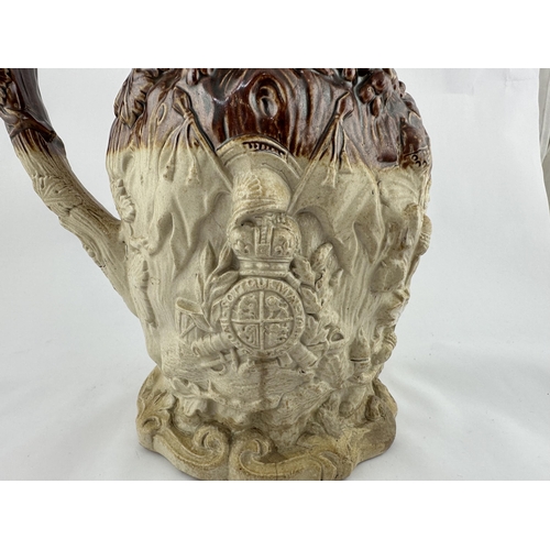 531 - SPRIGGED SALT GLAZE JUG. 9ins tall. Very heavily modelled with leaves, crown, militaria, acorns & al... 