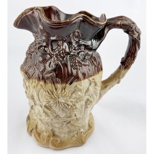 531 - SPRIGGED SALT GLAZE JUG. 9ins tall. Very heavily modelled with leaves, crown, militaria, acorns & al... 