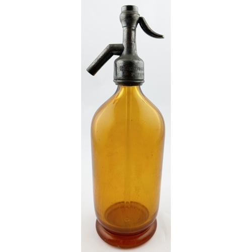 547 - PLYMOUTH SODA SYPHON. 11.6ins tall. Deep amber glass, footed base. Acid etched coat of arms to centr... 