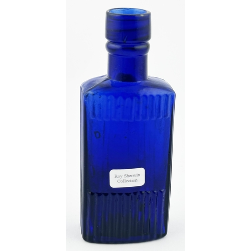 562 - OVAL POISON BOTTLE. (DP p106) 4.6ins tall. Cobalt blue, vertically ribbed with embossing POISON/ NOT... 