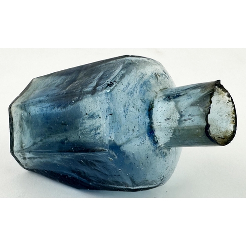 609 - OCTAGONAL TIPPER INK BOTTLE. (IB p265) 2.75ins long. Light blue glass, 30 degree base slant. Scarce ... 