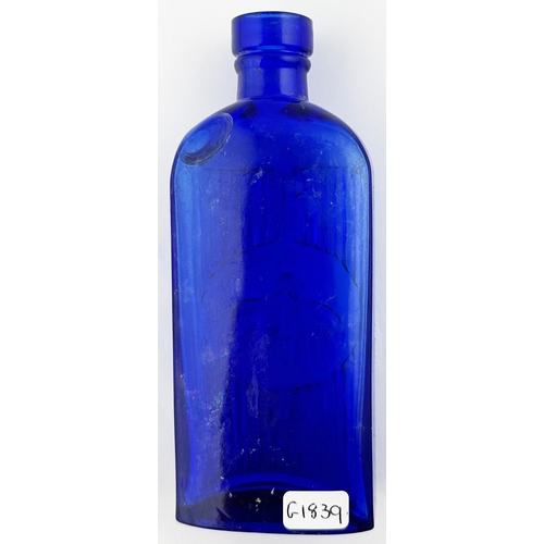 613 - CYONA POISON BOTTLE. (DP p108) 5.6ins tall. Cobalt blue, vertically ribbed with man & indian horse p... 