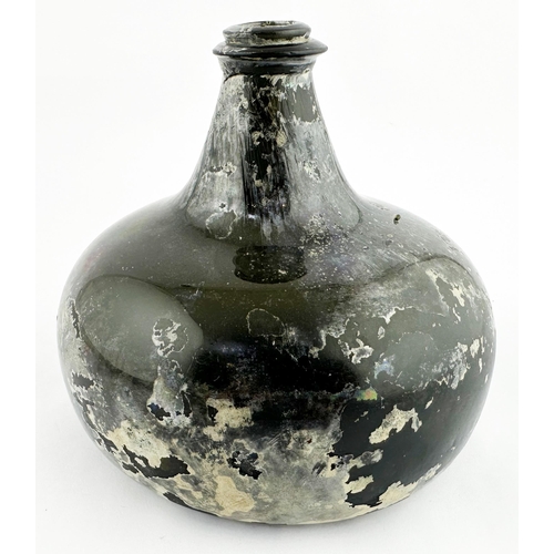 631 - ENGLISH ONION WINE BOTTLE. 5.5ins tall, black/ dark green glass. Overall patination/ irridescence. A... 