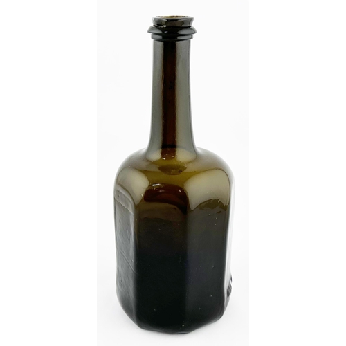 633 - ENGLISH OCTAGONAL BODIED WINE BOTTLE. 10ins tall. Black/ dark brown-green glass, c. 1755-60. Eight c... 