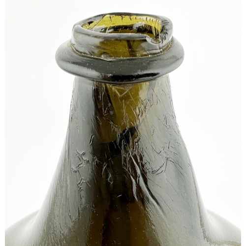 635 - ENGLISH MAGNUM SIZE BLADDER WINE. 10ins tall. Double capacity bladder form, black/ dark green glass.... 