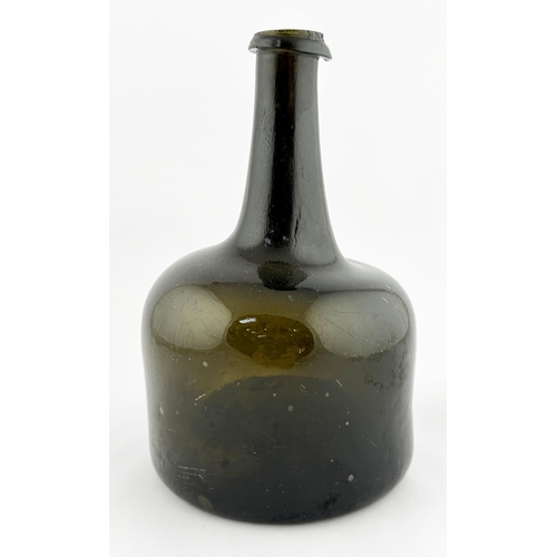 638 - ENGLISH MALLET WINE BOTTLE. 7.6ins tall, Black/ dark green glass, c. 1730-40, deep kick up, rough po... 