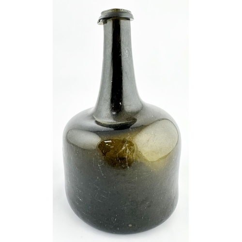 638 - ENGLISH MALLET WINE BOTTLE. 7.6ins tall, Black/ dark green glass, c. 1730-40, deep kick up, rough po... 