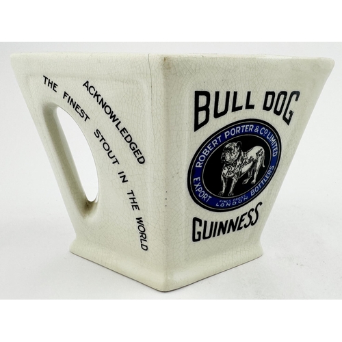 21 - ROBERT PORTER & CO BULL DOG GUINNESS. 4.4ins tall. Diamond shaped jug, integral handle. Black & blue... 