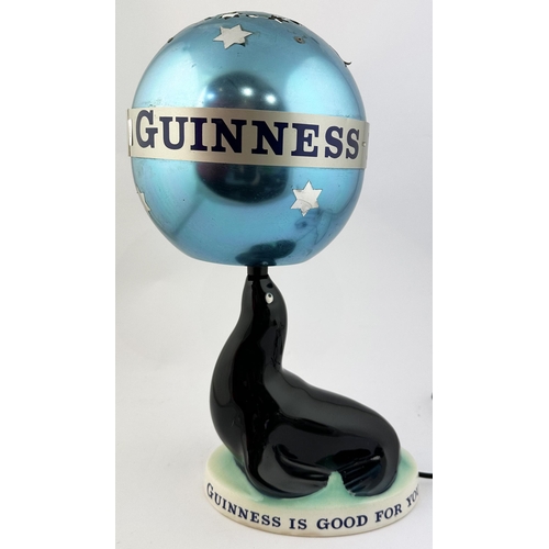 24 - GUINNESS SEAL LAMP. 15ins tall. Original ceramic seal figure set on turquiose base. GUINNESS IS GOOD... 