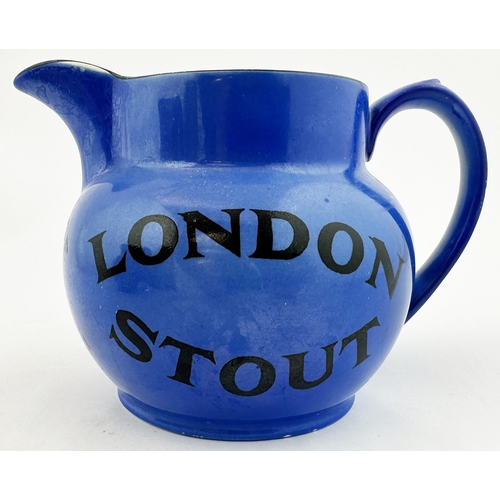 26 - COURAGE LONDON STOUT WATER JUG. 4.1ins tall, pouring lip, rear handle. Uneven mid blue body glaze. R... 