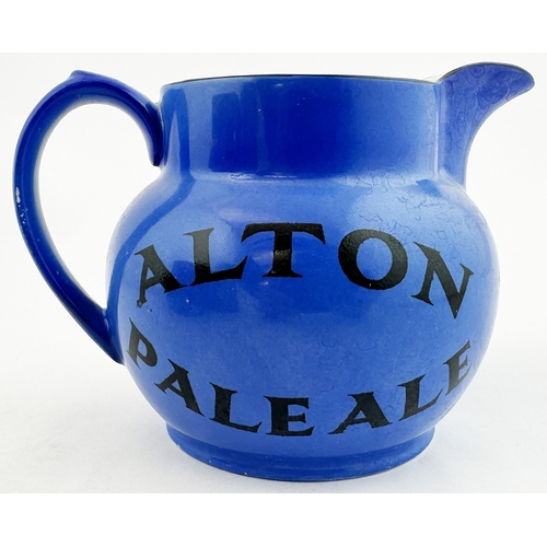 26 - COURAGE LONDON STOUT WATER JUG. 4.1ins tall, pouring lip, rear handle. Uneven mid blue body glaze. R... 