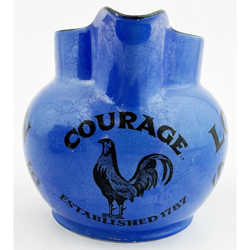 26 - COURAGE LONDON STOUT WATER JUG. 4.1ins tall, pouring lip, rear handle. Uneven mid blue body glaze. R... 