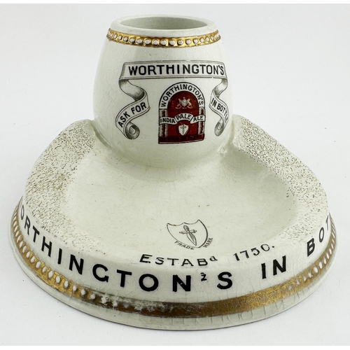 42 - WORTHINGTON IN BOTTLE MATCHSTRIKER & ASHTRAY. 5.5ins diam. Large footed base with slopping to either... 