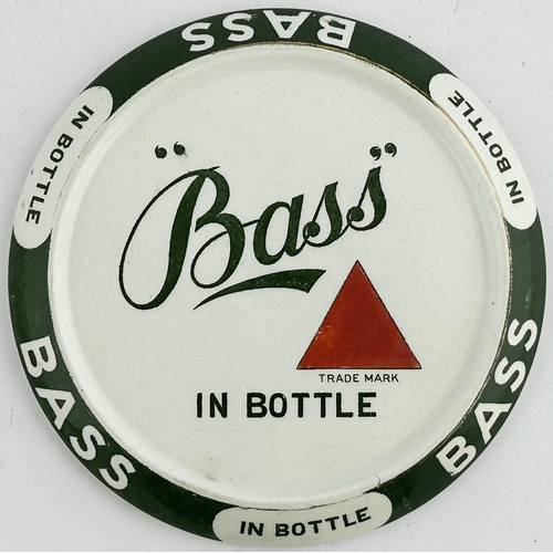 75 - BASS IN BOTTLE COASTER. 5ins diam. Small coaster, simple stylish Bass name around edge & to centre. ... 