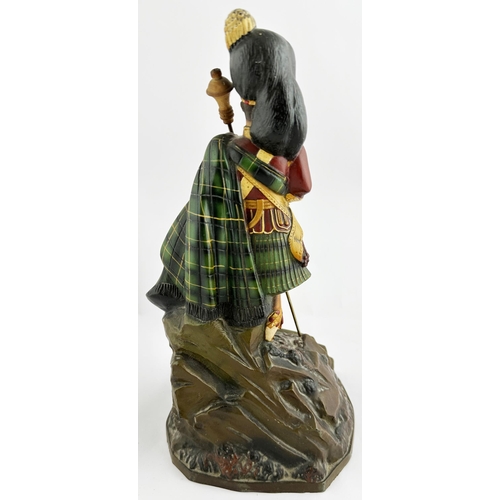 77 - DEWARS SCOTCH WHISKY ADVERTISING FIGURE. 12ins tall. A very rare, larger size, rubberoid kilted man ... 