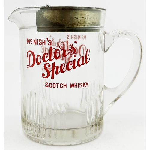 92 - . McNISH DOCTORS SPECIAL SCOTCH WHISKY GLASS WATER JUG. 5.6ins tall. Straight sided clear glass jug,... 