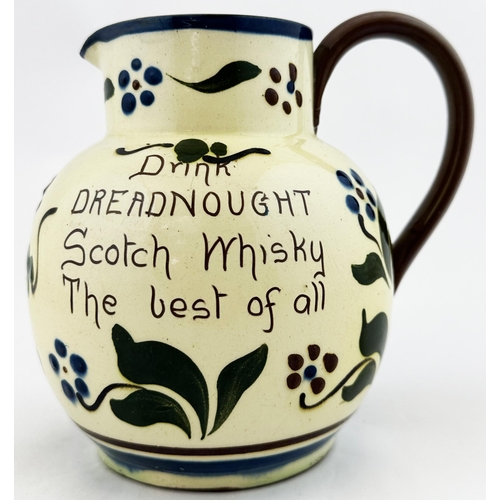 93 - DREADNAUGHT SCOTCH WHISKY JUG. 6.5ins tall. Floral sgrafitto decoration with both sides carrying ins... 