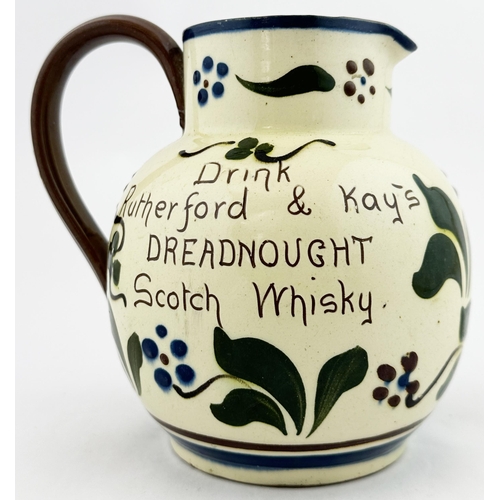 93 - DREADNAUGHT SCOTCH WHISKY JUG. 6.5ins tall. Floral sgrafitto decoration with both sides carrying ins... 