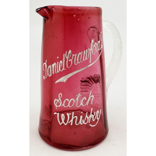 94 - DANIEL CRAWFORDS SCOTCH WHISKY WATER JUG. 5.3ins tall. Very small (cute?) cranberry tapering jug, wh... 