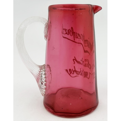 94 - DANIEL CRAWFORDS SCOTCH WHISKY WATER JUG. 5.3ins tall. Very small (cute?) cranberry tapering jug, wh... 