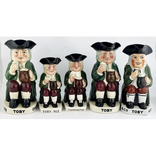 118 - TOBY ALE & STOUT TOBY JUG. 9.1ins tall. Familiar multi-coloured seated red cheeked toper, glass in h... 