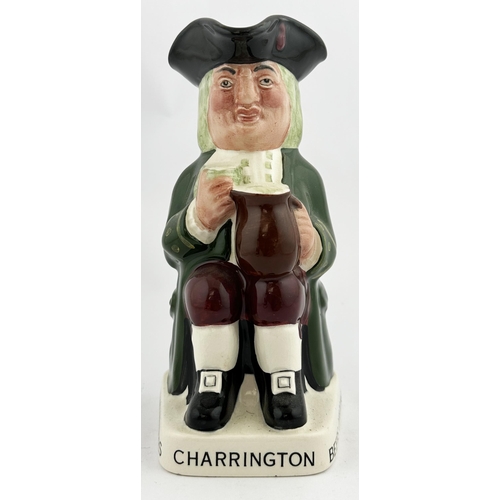 120 - CHARRINGTON STOUT TOB YJUG 7.4ins tall. Familiar multicoloured seated red cheeked toper, glass in h... 