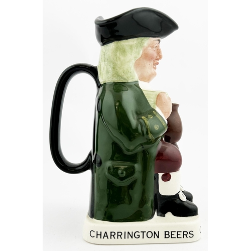 120 - CHARRINGTON STOUT TOB YJUG 7.4ins tall. Familiar multicoloured seated red cheeked toper, glass in h... 