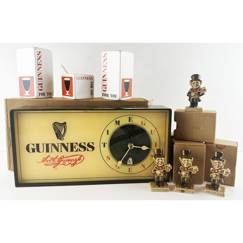 130 - GUINNESS MIXED LOT. Largest 14 x 7.5ins. Inc. Boxed clock, condements set & 4 x boxed mad hatter fig... 