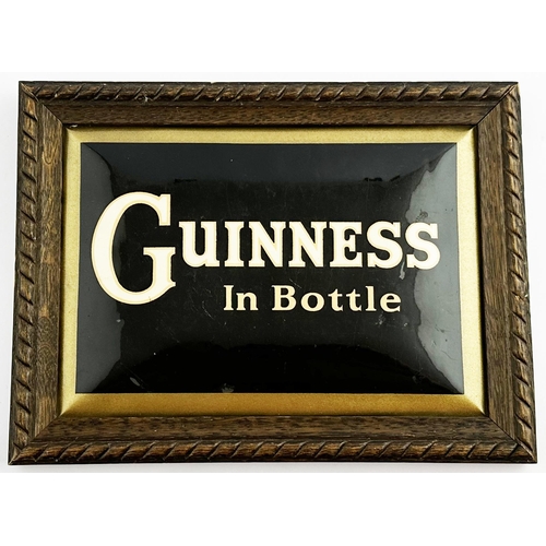 135 - GUINNESS IN BOTTLE LAMINATED FRAMED SHOWCARD. 10 x 7.5ins. Wooden framed laminated showcard. Substan... 