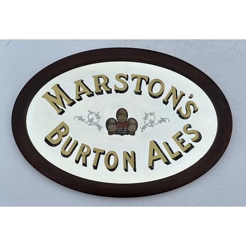 300 - MARSTONS BURTON ALES MIRROR. 33.5 x 23.5ins oval wooden frame. Gold lettering, multicoloured central... 